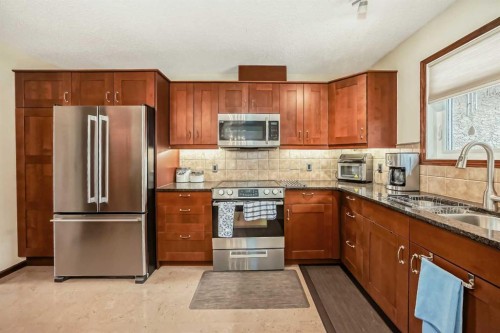 104 Kodiak Road, Canmore, AB - Indoor Photo Showing Kitchen With Double Sink