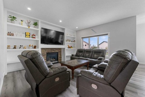 280 Windermere Drive, Chestermere, AB - Indoor Photo Showing Living Room With Fireplace
