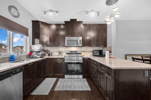 243 Evansborough Way Nw, Calgary, AB - Indoor Photo Showing Kitchen With Double Sink With Upgraded Kitchen