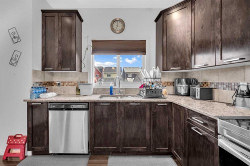 243 Evansborough Way Nw, Calgary, AB - Indoor Photo Showing Kitchen With Double Sink