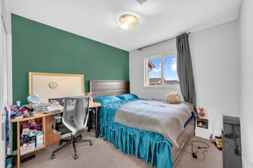 243 Evansborough Way Nw, Calgary, AB - Indoor Photo Showing Bedroom