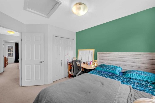 243 Evansborough Way Nw, Calgary, AB - Indoor Photo Showing Bedroom