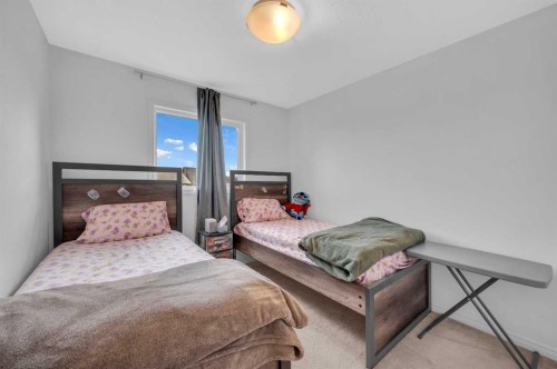 243 Evansborough Way Nw, Calgary, AB - Indoor Photo Showing Bedroom