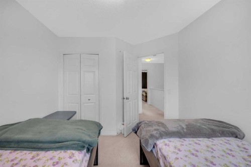 243 Evansborough Way Nw, Calgary, AB - Indoor Photo Showing Bedroom