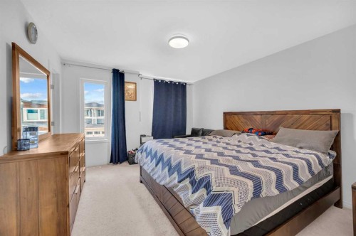 243 Evansborough Way Nw, Calgary, AB - Indoor Photo Showing Bedroom