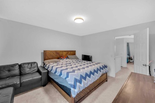 243 Evansborough Way Nw, Calgary, AB - Indoor Photo Showing Bedroom