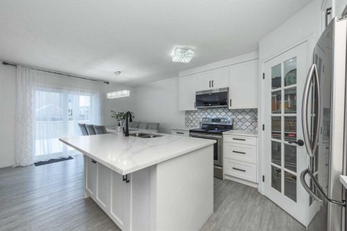 8430 Saddleridge Drive Ne, Calgary, AB - Indoor Photo Showing Kitchen With Stainless Steel Kitchen With Double Sink With Upgraded Kitchen