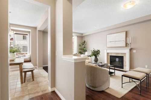 149 Windridge Road Sw, Airdrie, AB - Indoor Photo Showing Other Room With Fireplace