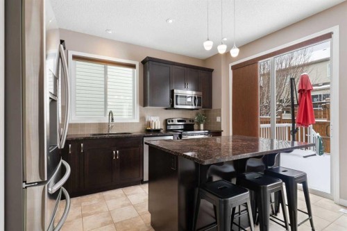 149 Windridge Road Sw, Airdrie, AB - Indoor Photo Showing Kitchen With Upgraded Kitchen