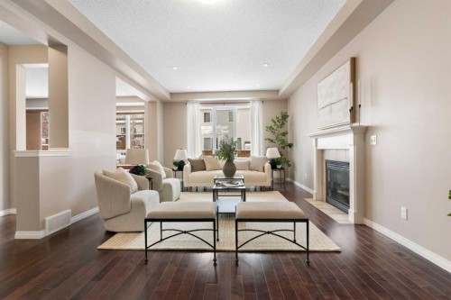 149 Windridge Road Sw, Airdrie, AB - Indoor Photo Showing Living Room With Fireplace