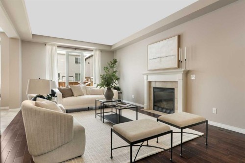 149 Windridge Road Sw, Airdrie, AB - Indoor Photo Showing Living Room With Fireplace
