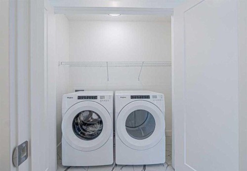 129 Dawson Wharf View, Chestermere, AB - Indoor Photo Showing Laundry Room