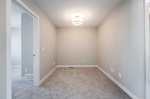 129 Dawson Wharf View, Chestermere, AB - Indoor Photo Showing Other Room