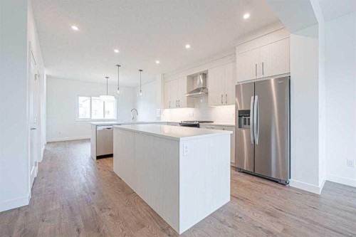 129 Dawson Wharf View, Chestermere, AB - Indoor Photo Showing Kitchen With Upgraded Kitchen