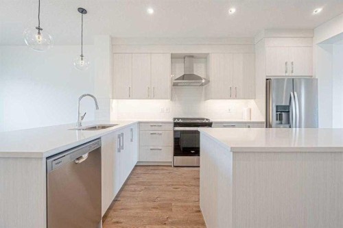 129 Dawson Wharf View, Chestermere, AB - Indoor Photo Showing Kitchen With Double Sink With Upgraded Kitchen
