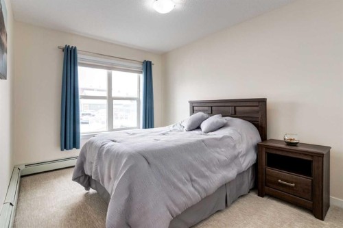 121-402 Marquis Lane Se, Calgary, AB - Indoor Photo Showing Bedroom