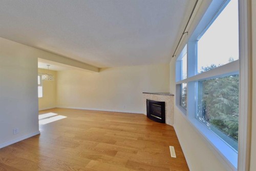 525 32 Avenue Ne, Calgary, AB - Indoor Photo Showing Other Room With Fireplace