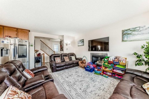 151 Covepark Green Ne, Calgary, AB - Indoor Photo Showing Living Room With Fireplace