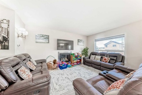 151 Covepark Green Ne, Calgary, AB - Indoor Photo Showing Living Room With Fireplace