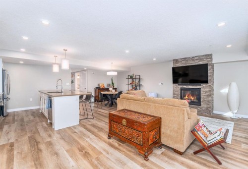 103-810 7Th Street, Canmore, AB - Indoor Photo Showing Living Room With Fireplace