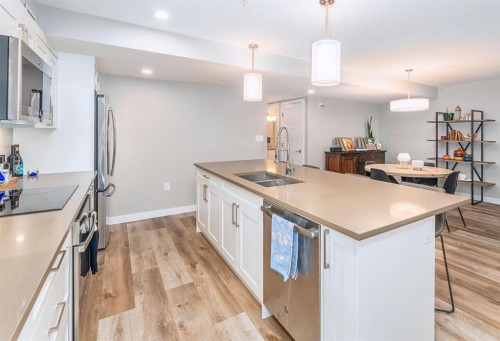 103-810 7Th Street, Canmore, AB - Indoor Photo Showing Kitchen With Double Sink With Upgraded Kitchen