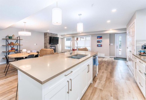 103-810 7Th Street, Canmore, AB - Indoor Photo Showing Kitchen With Double Sink