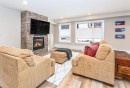103-810 7Th Street, Canmore, AB  - Indoor Photo Showing Living Room With Fireplace 