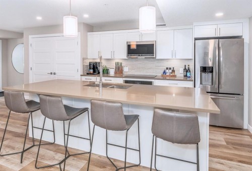 103-810 7Th Street, Canmore, AB - Indoor Photo Showing Kitchen With Double Sink With Upgraded Kitchen