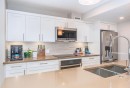 103-810 7Th Street, Canmore, AB  - Indoor Photo Showing Kitchen With Double Sink With Upgraded Kitchen 