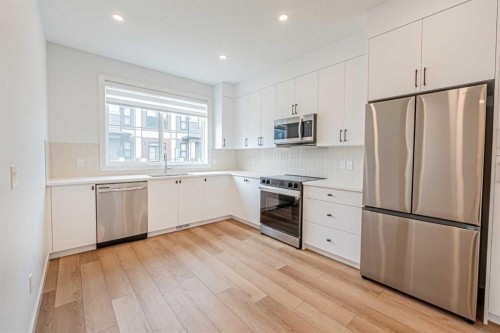 101-550 Seton Circle Se, Calgary, AB - Indoor Photo Showing Kitchen With Stainless Steel Kitchen With Upgraded Kitchen