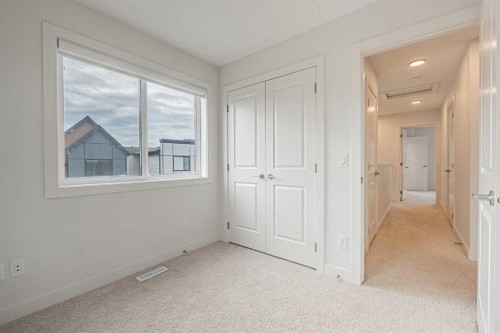 101-550 Seton Circle Se, Calgary, AB - Indoor Photo Showing Other Room