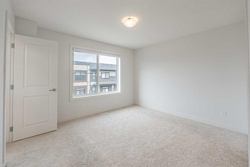 101-550 Seton Circle Se, Calgary, AB - Indoor Photo Showing Other Room