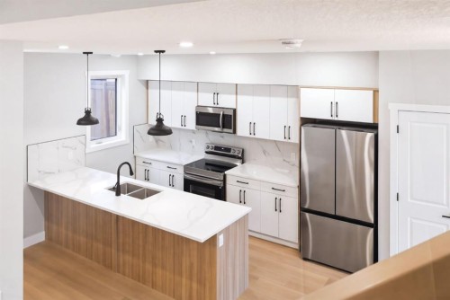 1636 19 Avenue Nw, Calgary, AB - Indoor Photo Showing Kitchen With Double Sink With Upgraded Kitchen