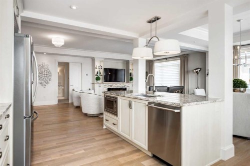 306-131 Quarry Way Se, Calgary, AB - Indoor Photo Showing Kitchen With Stainless Steel Kitchen With Upgraded Kitchen