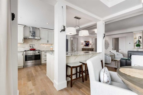 306-131 Quarry Way Se, Calgary, AB - Indoor Photo Showing Kitchen With Upgraded Kitchen