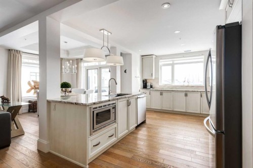306-131 Quarry Way Se, Calgary, AB - Indoor Photo Showing Kitchen With Stainless Steel Kitchen With Upgraded Kitchen