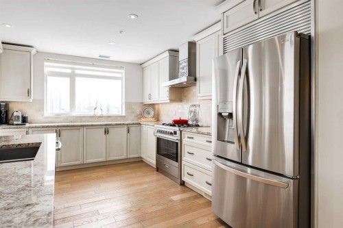 306-131 Quarry Way Se, Calgary, AB - Indoor Photo Showing Kitchen With Stainless Steel Kitchen With Upgraded Kitchen