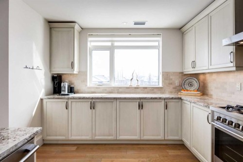 306-131 Quarry Way Se, Calgary, AB - Indoor Photo Showing Kitchen With Upgraded Kitchen