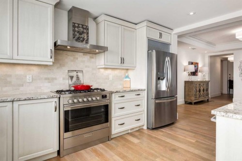 306-131 Quarry Way Se, Calgary, AB - Indoor Photo Showing Kitchen With Stainless Steel Kitchen With Upgraded Kitchen