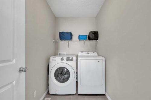 87 Panton Landing Nw, Calgary, AB - Indoor Photo Showing Laundry Room