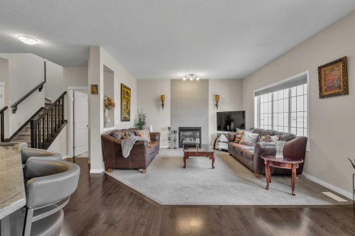 87 Panton Landing Nw, Calgary, AB - Indoor Photo Showing Living Room With Fireplace