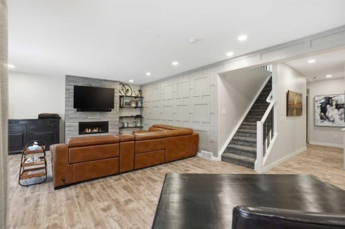 111 Crestridge View Sw, Calgary, AB - Indoor Photo Showing Living Room With Fireplace