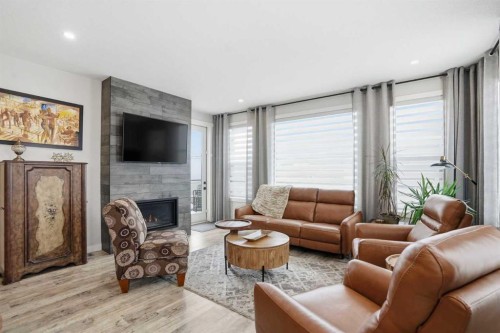 111 Crestridge View Sw, Calgary, AB - Indoor Photo Showing Living Room With Fireplace