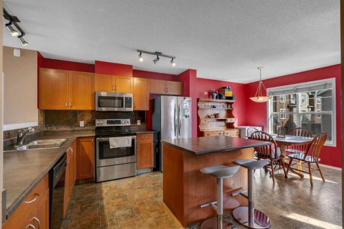 320 Elgin Gardens Se, Calgary, AB - Indoor Photo Showing Kitchen With Double Sink
