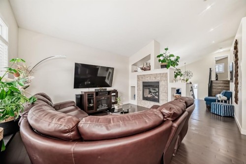 612 Montgomery Close Se, High River, AB - Indoor Photo Showing Living Room With Fireplace