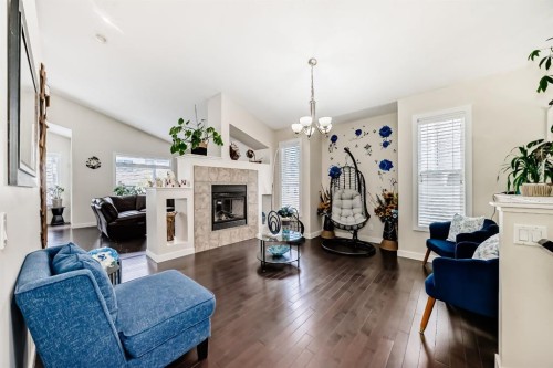612 Montgomery Close Se, High River, AB - Indoor Photo Showing Living Room With Fireplace