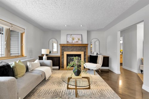 4712 Grove Hill Road Sw, Calgary, AB - Indoor Photo Showing Living Room With Fireplace
