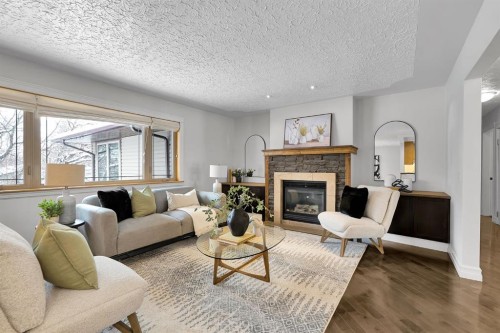 4712 Grove Hill Road Sw, Calgary, AB - Indoor Photo Showing Living Room With Fireplace