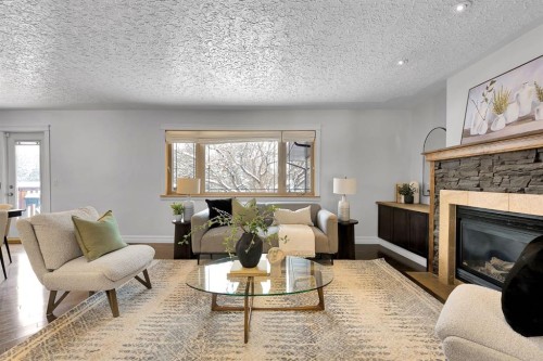 4712 Grove Hill Road Sw, Calgary, AB - Indoor Photo Showing Living Room With Fireplace