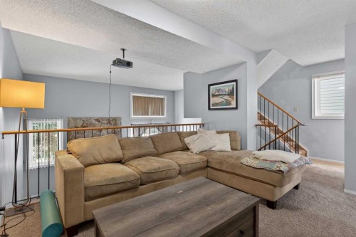 53 Millrise Lane Sw, Calgary, AB - Indoor Photo Showing Living Room
